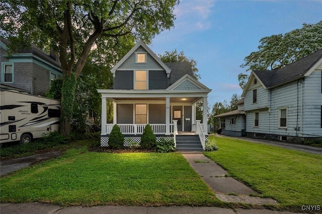 117 Prospect St, Lenox, NY 13032 - victorian home featuring a porch and a front yard
