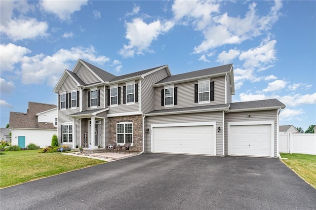 27 Gainsborough Pl, Henrietta, NY 14586 - view of front of home featuring asphalt driveway, an attached garage, stone siding, and a garage