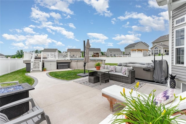 27 Gainsborough Pl, Henrietta, NY 14586 - fenced backyard featuring a hot tub, a residential view, a patio, and an outdoor living space with a fire pit