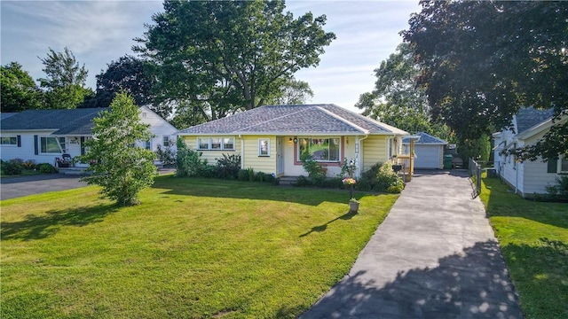 105 Vinedale Ave, Irondequoit, NY 14622 - bungalow-style home featuring a front yard and a detached garage