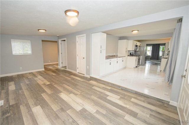 118 Hanover Ave, Salina, NY 13088 - unfurnished living room featuring light wood-style floors