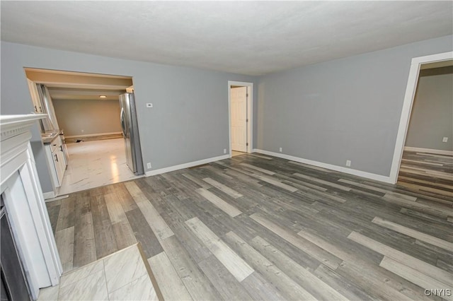 118 Hanover Ave, Salina, NY 13088 - unfurnished living room featuring wood finished floors and baseboards