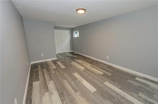 118 Hanover Ave, Salina, NY 13088 - unfurnished bedroom featuring wood finished floors and a closet