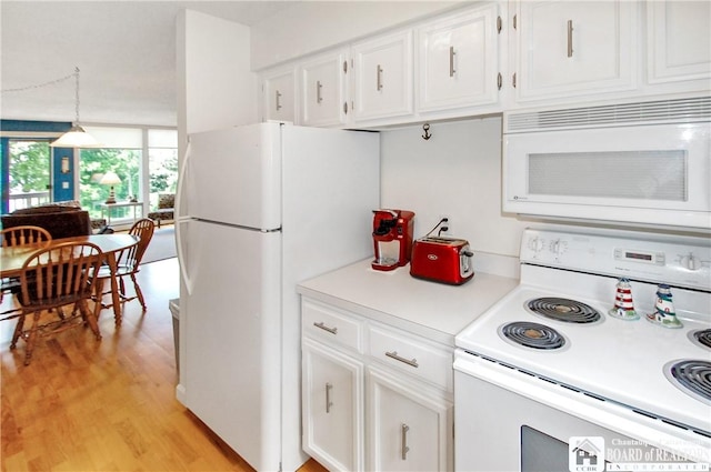 C4 Oneida Dr, Chautauqua, NY 14728 - kitchen with white appliances, light wood-type flooring, light countertops, and white cabinetry