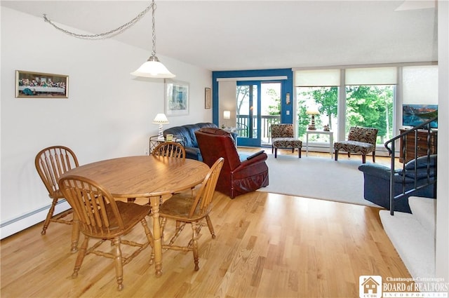 C4 Oneida Dr, Chautauqua, NY 14728 - dining room featuring light wood-style floors and baseboard heating