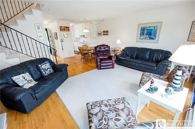 C4 Oneida Dr, Chautauqua, NY 14728 - living area with wood finished floors and stairway