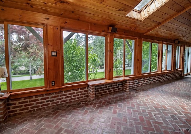 4790 E Lake Rd, Cazenovia, NY 13035 - unfurnished sunroom with a skylight, brick floors, and wood ceiling