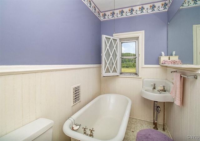 4790 E Lake Rd, Cazenovia, NY 13035 - bathroom with a soaking tub and a wainscoted wall
