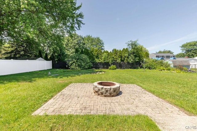 7921 Davis Rd N, Clay, NY 13041 - view of yard featuring an outdoor fire pit and a patio area