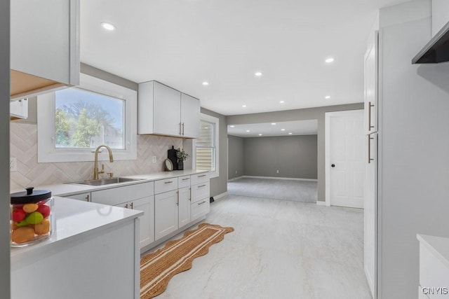 7921 Davis Rd N, Clay, NY 13041 - kitchen with decorative backsplash, light countertops, recessed lighting, and white cabinetry