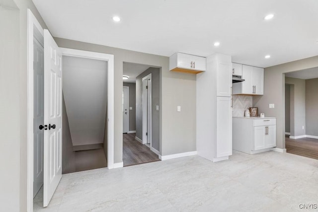 7921 Davis Rd N, Clay, NY 13041 - kitchen featuring white cabinets, recessed lighting, and light countertops