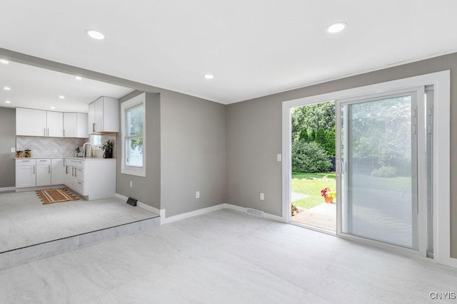 7921 Davis Rd N, Clay, NY 13041 - unfurnished living room with recessed lighting
