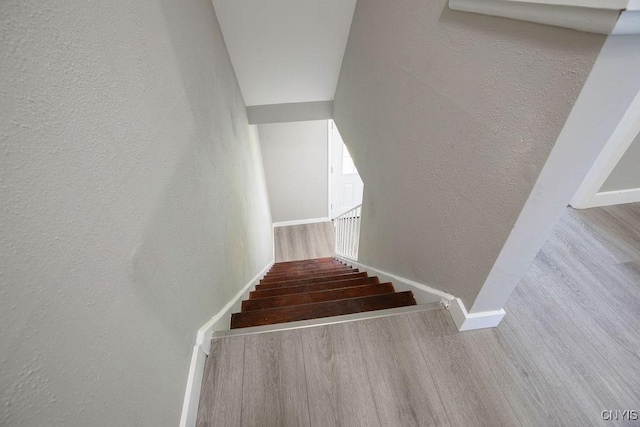 7921 Davis Rd N, Clay, NY 13041 - stairway featuring wood finished floors and a textured wall