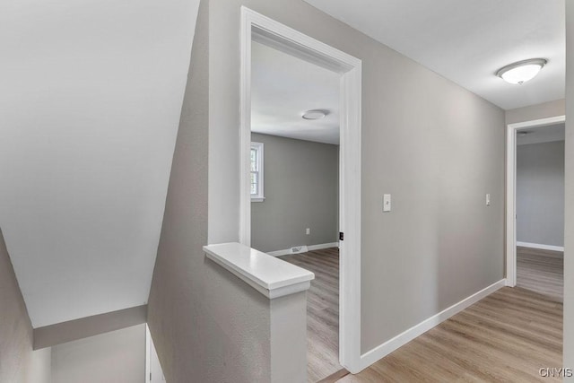 7921 Davis Rd N, Clay, NY 13041 - corridor featuring light wood-type flooring and baseboards
