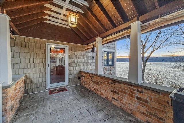 4555 Davies Rd, Hector, NY 14818 - unfurnished sunroom with a water view and stone finish flooring