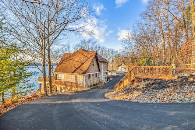 4555 Davies Rd, Hector, NY 14818 - view of side of property with stairway and asphalt driveway