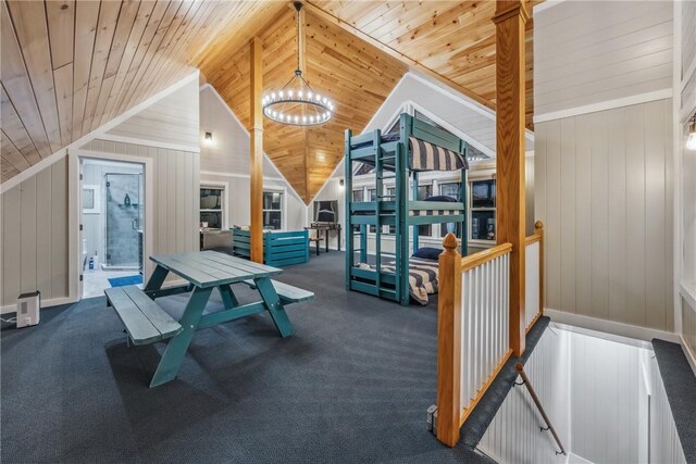 4555 Davies Rd, Hector, NY 14818 - playroom with a chandelier, wood ceiling, vaulted ceiling, wood walls, and carpet flooring