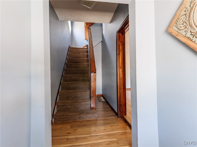 308 Howk St, Watertown City, NY 13601 - stairs featuring wood finished floors and baseboards