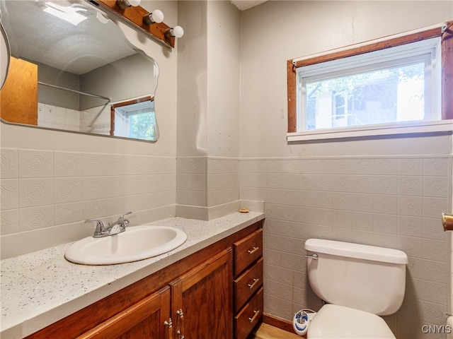 308 Howk St, Watertown City, NY 13601 - full bath with vanity, a shower, and a wainscoted wall
