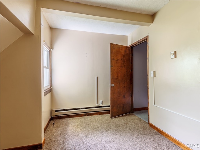 308 Howk St, Watertown City, NY 13601 - carpeted spare room with a baseboard radiator