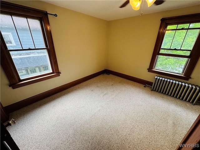39 Chestnut St, Persia, NY 14070 - unfurnished room with radiator, ceiling fan, and light colored carpet