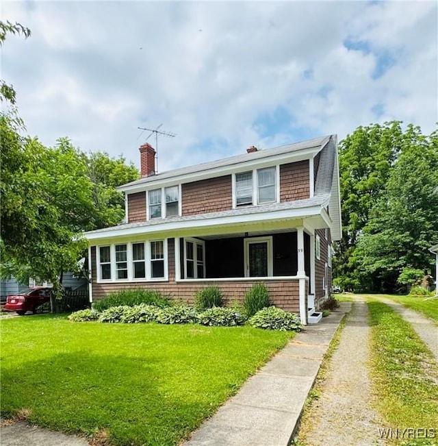 39 Chestnut St, Persia, NY 14070 - view of front of house with a chimney, dirt driveway, and a front yard