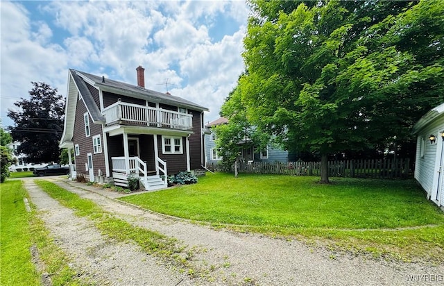39 Chestnut St, Persia, NY 14070 - back of property featuring a balcony, a chimney, and driveway