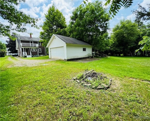 39 Chestnut St, Persia, NY 14070 - view of green lawn with an outbuilding and a garage