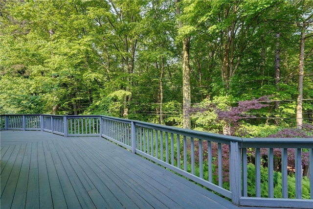 120 Scotch Ln, Irondequoit, NY 14617 - wooden terrace with a forest view