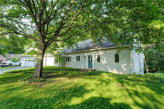 120 Scotch Ln, Irondequoit, NY 14617 - ranch-style home featuring asphalt driveway, a front yard, and an attached garage