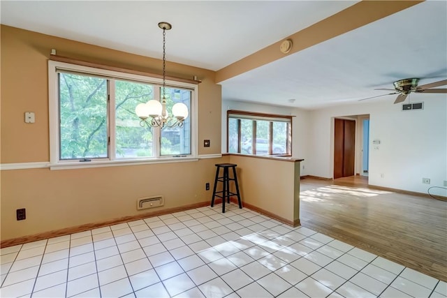 120 Scotch Ln, Irondequoit, NY 14617 - unfurnished room featuring a chandelier, a ceiling fan, a smoke detector, and light wood-style floors