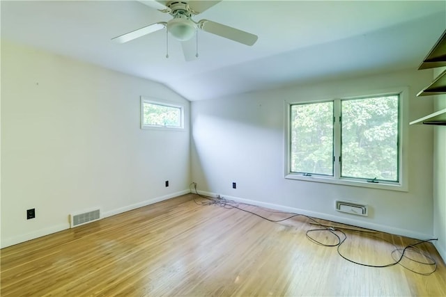 120 Scotch Ln, Irondequoit, NY 14617 - spare room featuring vaulted ceiling, wood finished floors, and ceiling fan
