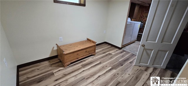 3254 Weatherby Rd, Clarksville, NY 14739 - spare room with washer and dryer and light wood-style floors