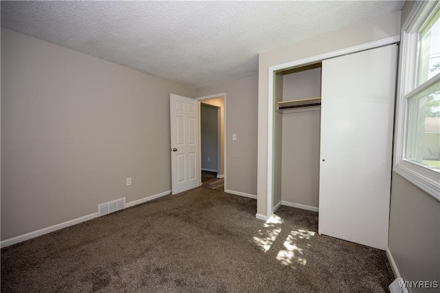 261 Ehinger Dr, West Seneca, NY 14224 - unfurnished bedroom featuring carpet flooring, a closet, a textured ceiling, and a baseboard heating unit