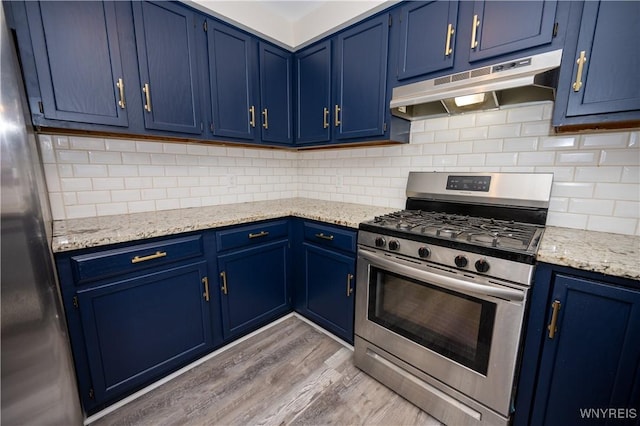 261 Ehinger Dr, West Seneca, NY 14224 - kitchen featuring gas stove, under cabinet range hood, and blue cabinets
