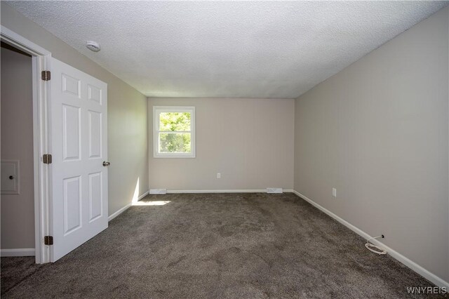 261 Ehinger Dr, West Seneca, NY 14224 - carpeted spare room with a textured ceiling and a smoke detector