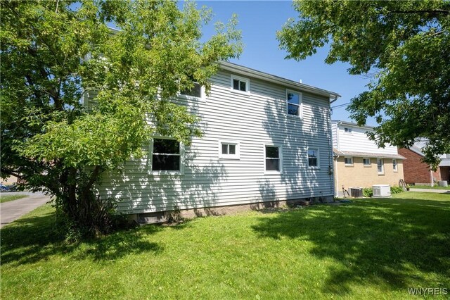 261 Ehinger Dr, West Seneca, NY 14224 - view of side of property featuring a lawn and a central AC unit