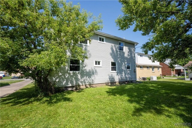 261 Ehinger Dr, West Seneca, NY 14224 - view of side of property featuring a yard and a central AC unit