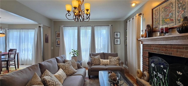 3390 Conhocton Rd, Erwin, NY 14870 - living area featuring a chandelier, plenty of natural light, and a brick fireplace
