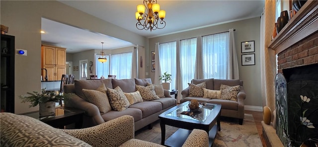 3390 Conhocton Rd, Erwin, NY 14870 - living room with a fireplace, a chandelier, and light wood-style floors