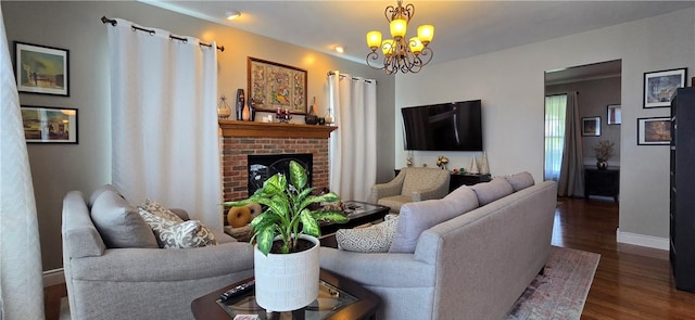 3390 Conhocton Rd, Erwin, NY 14870 - living room featuring dark wood finished floors, a brick fireplace, and a chandelier