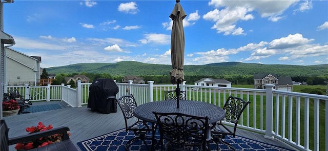 3390 Conhocton Rd, Erwin, NY 14870 - deck featuring a mountain view, outdoor dining space, a yard, and a grill