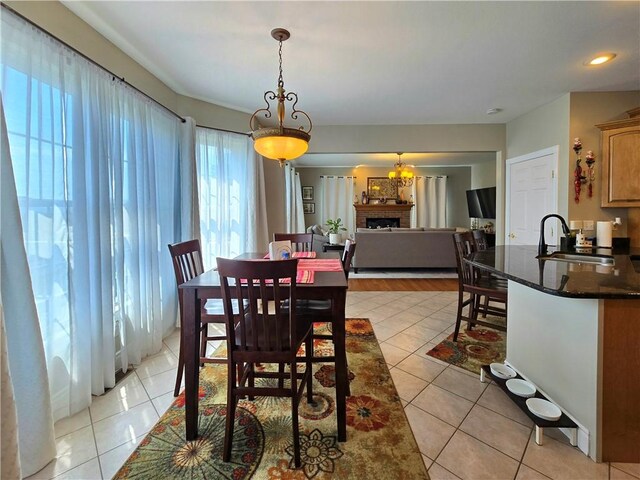3390 Conhocton Rd, Erwin, NY 14870 - dining room with light tile patterned floors and a fireplace