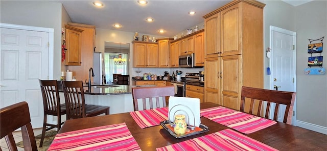 3390 Conhocton Rd, Erwin, NY 14870 - kitchen featuring stainless steel appliances, a peninsula, dark countertops, and recessed lighting