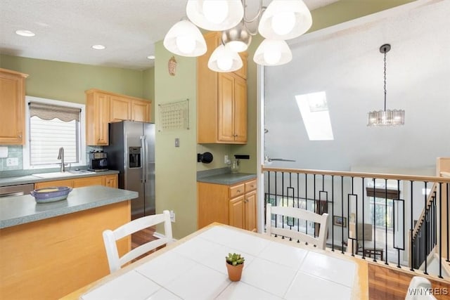 89 Rambling Rd, Amherst, NY 14051 - kitchen featuring a chandelier, a skylight, light brown cabinets, hanging light fixtures, and stainless steel fridge with ice dispenser