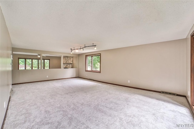 210 Townline Rd, Elma, NY 14059 - carpeted empty room featuring plenty of natural light and a textured ceiling
