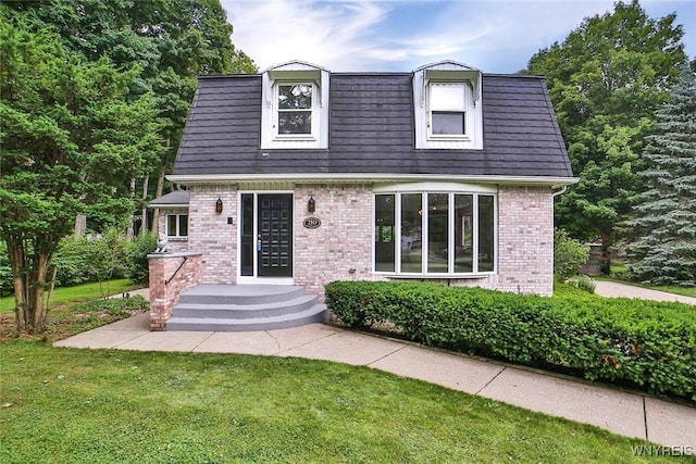 210 Townline Rd, Elma, NY 14059 - view of front of home featuring brick siding and a front yard