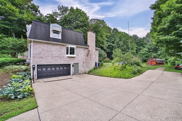 210 Townline Rd, Elma, NY 14059 - view of property exterior featuring an attached garage, brick siding, concrete driveway, and a chimney