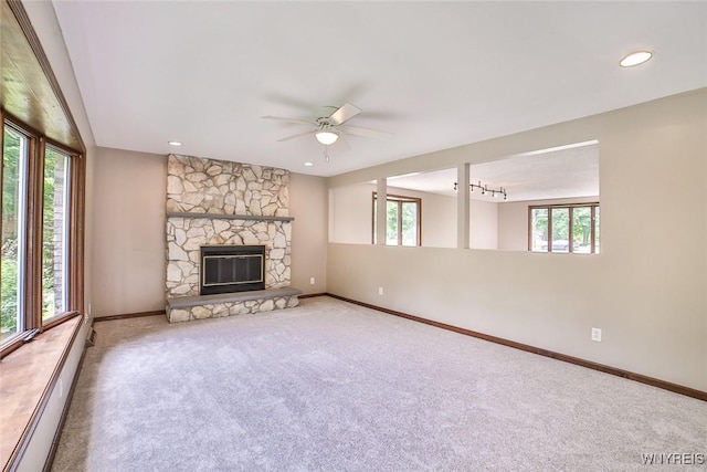 210 Townline Rd, Elma, NY 14059 - unfurnished living room with a baseboard radiator, carpet flooring, a ceiling fan, a fireplace, and recessed lighting