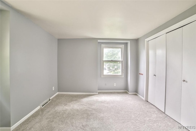 210 Townline Rd, Elma, NY 14059 - unfurnished bedroom featuring light carpet and a closet